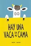 HAY UNA VACA EN MI CAMA